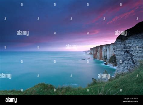 dramatic fire sunrise over cliffs in ocean, Etretat, France Stock Photo - Alamy