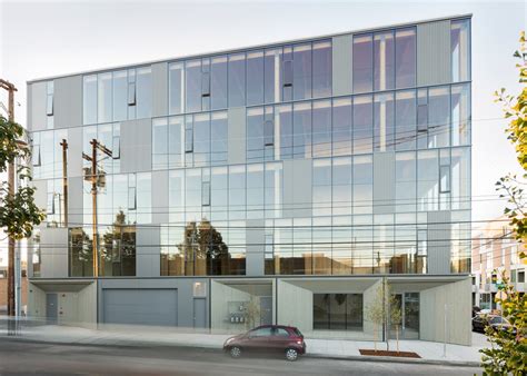 Glass facade reveals timber structure of Frame Work building in Portland