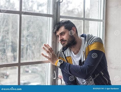 Sad Bearded Man Looking through the Window Stock Image - Image of ...