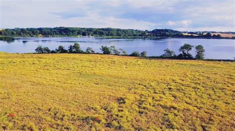 Drone View Of A Lake With Reflection Of The Blue Sky Free Stock Video Footage, Royalty-Free 4K ...