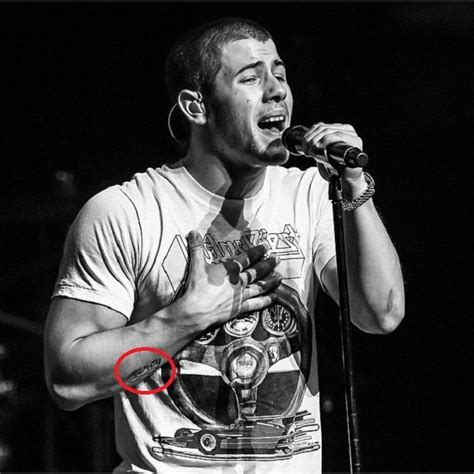 Nick Jonas' 3 Tattoos & Their Meanings - Body Art Guru