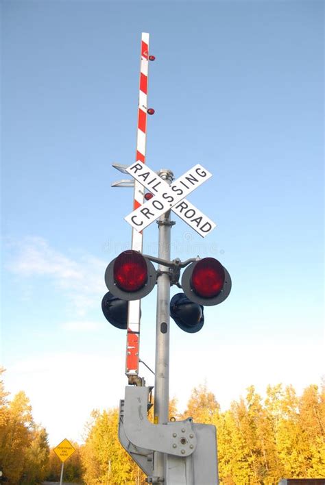 Railroad Crossing with the Arm Up Stock Image - Image of skies, blue ...