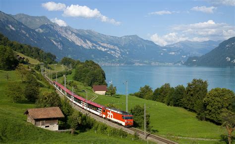 Zentralbahn Interregio train following the Lake Brienz shoreline along ...