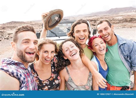 Group of Travel Friends Taking Selfie in the Desert during a Roadtrip - Happy Young People ...