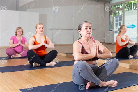 Woman Making Yoga Meditation in Half King of Fish Yoga Pose - Agni Stambhasana Stock Image ...