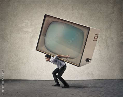 Man carrying a giant tv Stock Photo | Adobe Stock