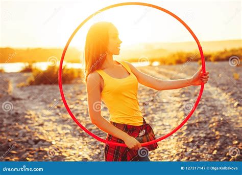 Girl with hoops in nature stock image. Image of leisure - 127317147