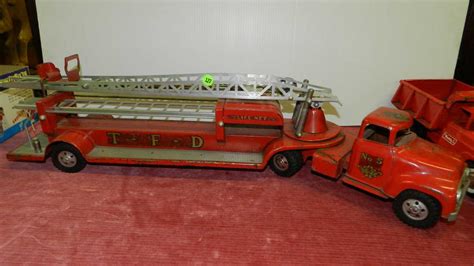 large antique metal toy fire truck / ladder truck