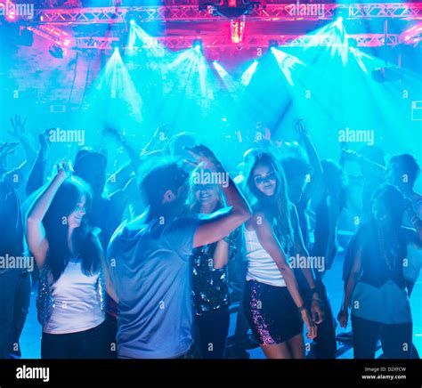 People dancing on dance floor of nightclub Stock Photo - Alamy