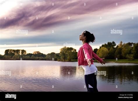 A woman taking a break at lake Stock Photo - Alamy