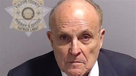 Former Trump lawyer Rudy Giuliani turns himself in over election fraud ...