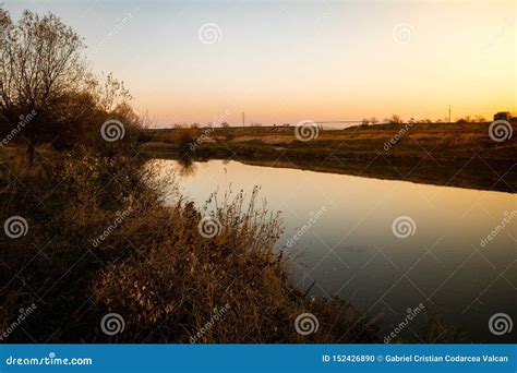 View of a Calm River with Sunset Light Stock Photo - Image of landscape, nature: 152426890