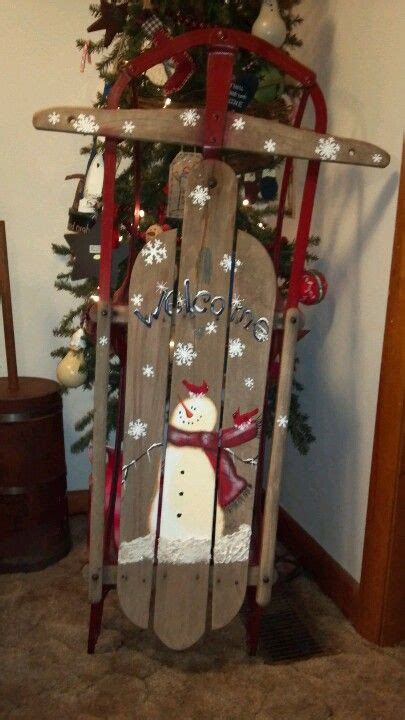 "Whimsical Hand-Painted Sled for a Delightful Winter Adventure"