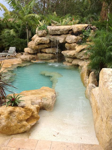 Sand entrance to our latest all natural stone tropical style pool. Tropical Pool Landscaping ...