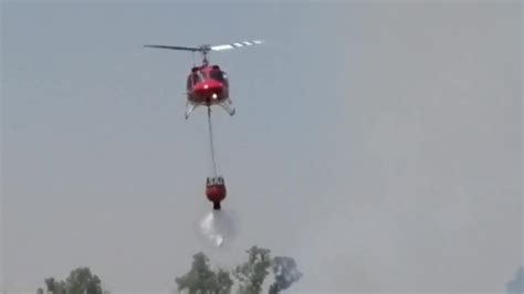 Raw: Helicopter Water Drop Over Par Fire - YouTube