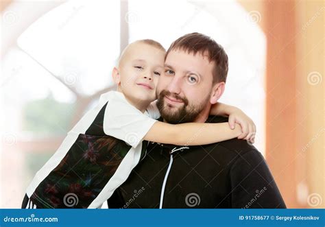 Dad and son hug. stock image. Image of young, school - 91758677