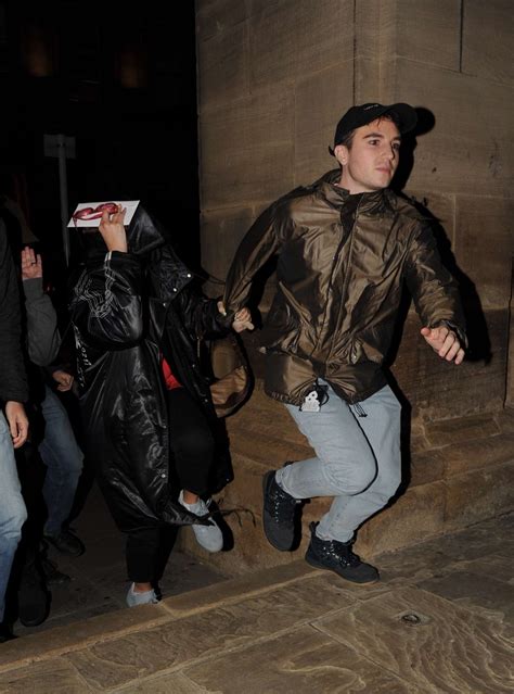 Dua Lipa: Hides from paparazzi in Manchester -03 | GotCeleb