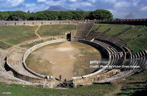 Roman Amphitheatre Of Pompeii And Mount Vesuvius In The Background Naples Italy High-Res Stock ...