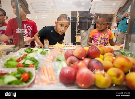 Elementary school children choosing healthy foods at school cafeteria ...