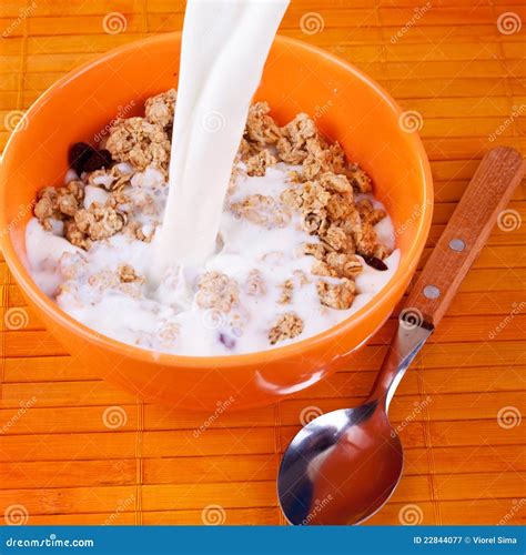 Milk pouring on cereal stock image. Image of snack, milk - 22844077