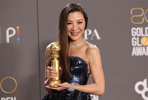 Michelle Yeoh, 60, stuns at the 2023 Golden Globes: 'A living princess'