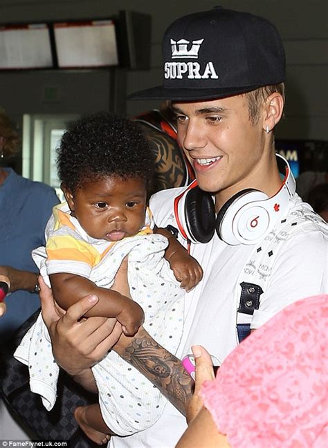 Justin Bieber ditches pop brat image as superstar holds baby and greets ...