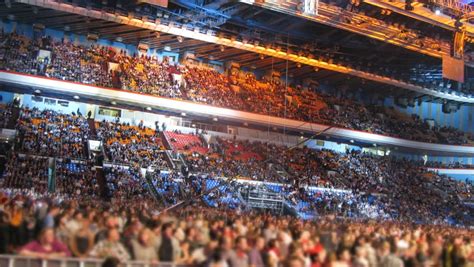 Crowd In Busy Stadium Sporting Event Blurred. Crowd Of Fans Gather Into A Large Stadium For A ...