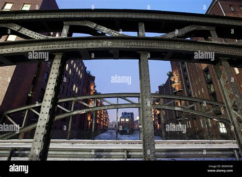 View of bridge during winter in Speicherstadt historic warehouse ...