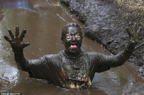 Runners trawl up to their necks in mud for 10K Muddy Trials | Daily Mail Online