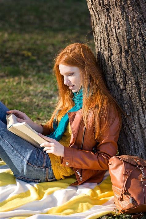 Concentrated Smart Girl Reading a Book Under the Tree Stock Image - Image of pretty, portrait ...