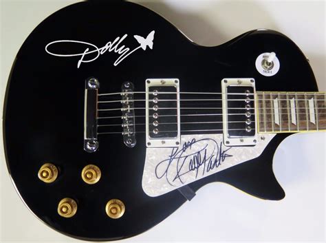 Lot Detail - Dolly Parton Signed Guitar (PSA/JSA Guaranteed)