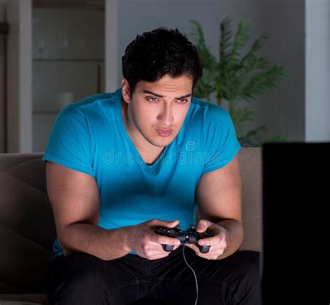 Young Man Playing Computer Games Late at Night Stock Image - Image of ...