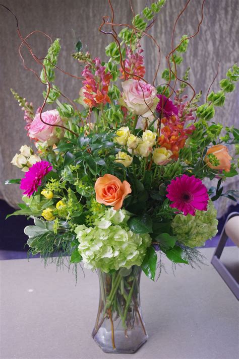 Tall vase arrangement featuring gerber daisies, hydrangeas, long-stem roses, spr… | Spring ...