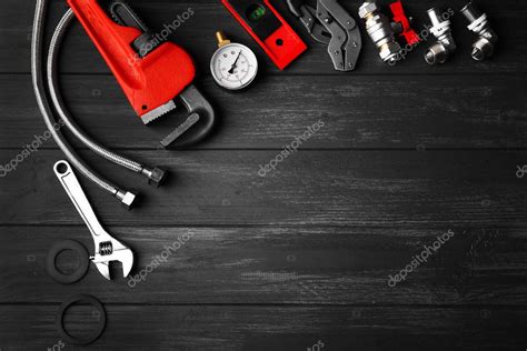 Plumber tools on background Stock Photo by ©belchonock 126256492