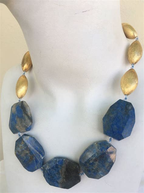 Lapis Gold Necklace, hand knotted, flat Blue Lapis Luzuli, almond shape, brush gold bead with 14 ...