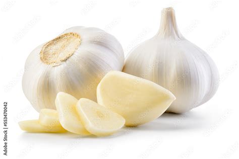 Garlic bulb and clove isolated. Garlic bulbs with sliced cloves on ...