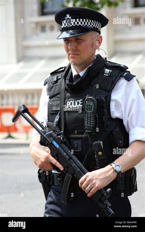 An armed Metropolitan police officer on Whitehall, Westminster, London, England, U.K Stock Photo ...