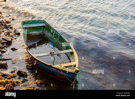 Old wooden fishing boat at sunset Stock Photo - Alamy