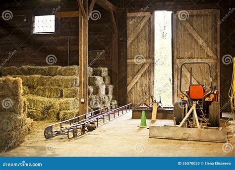 Barn Interior With Hay Bales And Farm Equipment Stock Photos - Image: 26070033