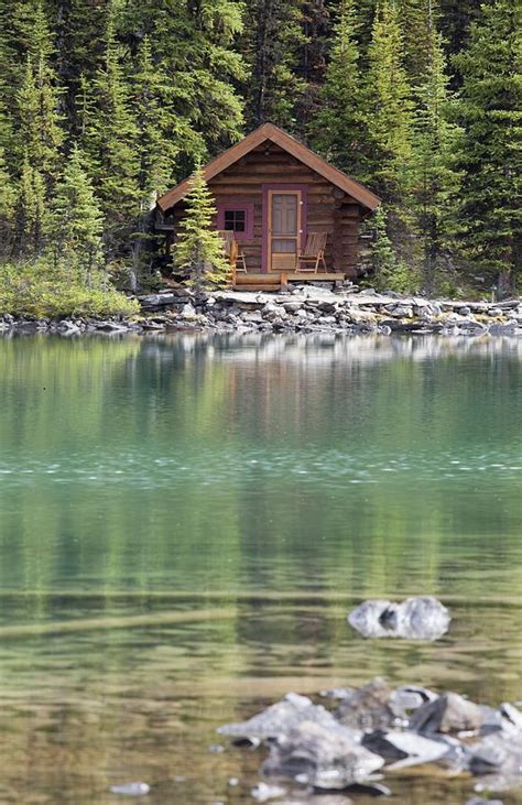 Wooden Cabin Along A Lake Shore Photograph by Michael Interisano