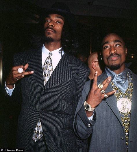 Tupac... lives! Snoop Dogg joined on stage by slain rapper as he's 'resurrected' to perform with ...