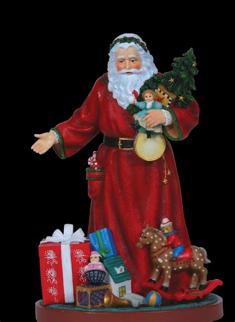 a santa clause figurine with presents around him