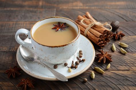 Homemade Indian tea. Spiced tea with milk on the rustic wooden table. - Your Live Well Journey