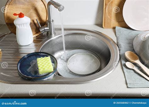 Washing Plates and Sponge in Kitchen Sink Stock Photo - Image of chores ...