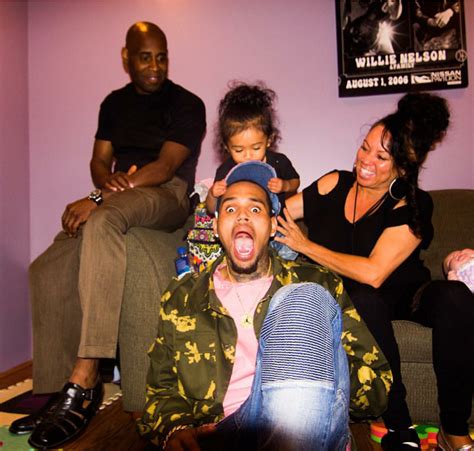 Chris Brown with mother and father and daughter Royalty share family moments.