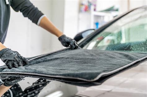 Wiping the Car Hood with a Microfiber Cloth for Better Shine. Hand Wash Luxury Cars Stock Image ...