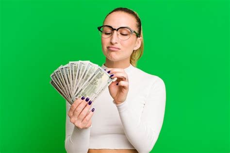 Premium Photo | Young pretty woman with dollar banknotes