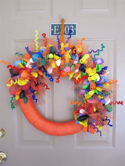 My rendition of the birthday balloon wreath. The orange tulle can be changed according to which ...