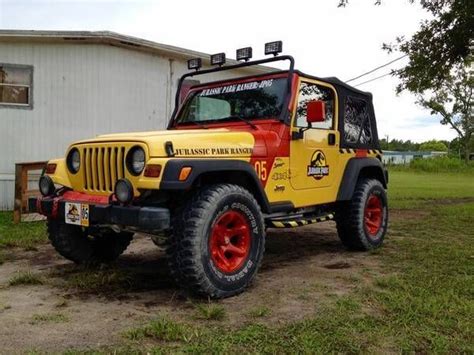 Yellow 2001 Jurassic Park Jeep Wrangler TJ Sport 4x4 l6