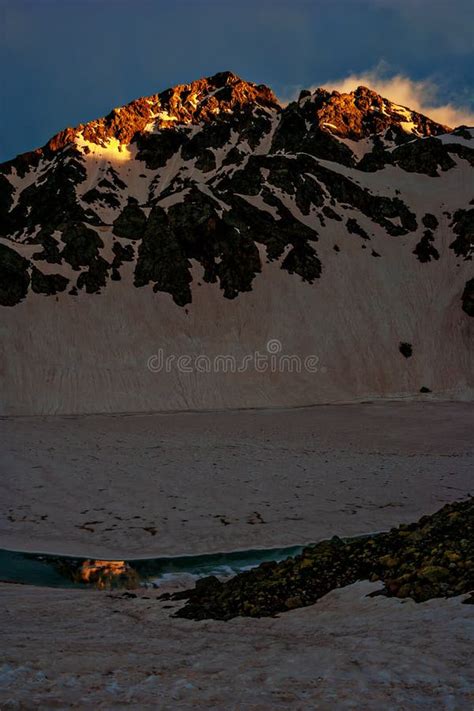 Mountain Snowy Peak Illuminated by the Setting Sun Stock Photo - Image ...